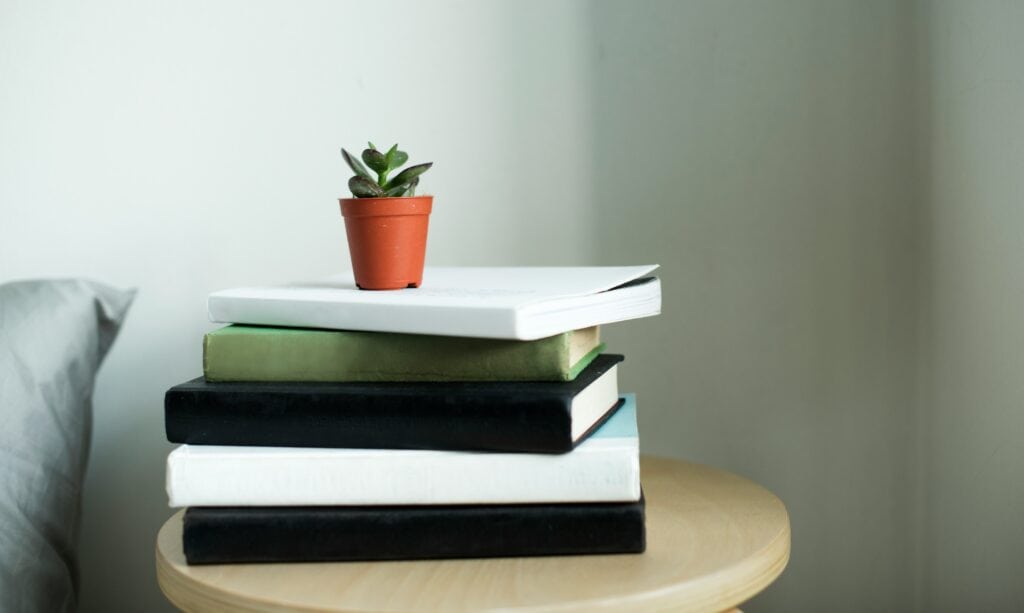 Stack of books symbolizing a clear learning path to study interior design online