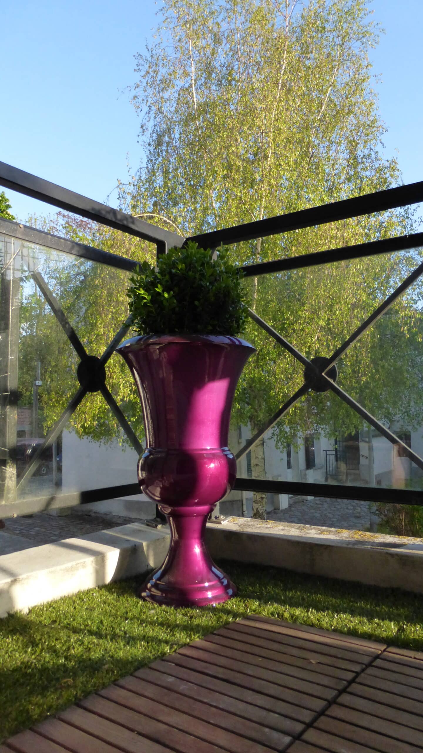 large decorative amphora pot in a balcony, outdoor decor inspiration for French-inspired garden design