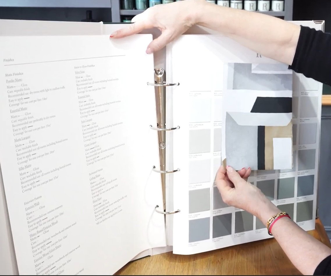 Interior designer selecting colors from a sample palette to learn interior design skills online