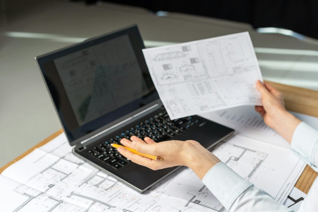 Person feeling stuck while planning an interior layout and looking at a confusing floor plan